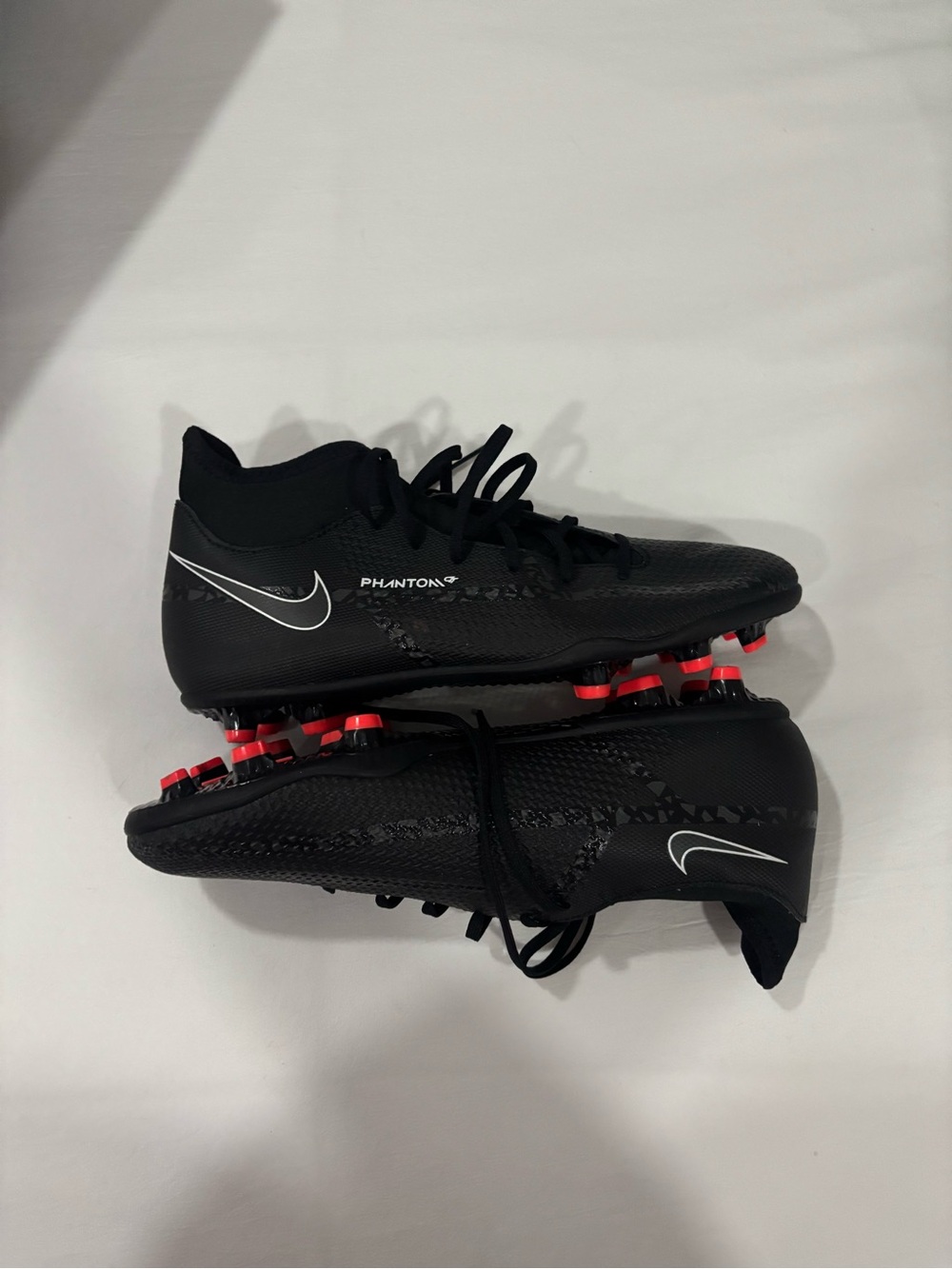 Nike Kids' Phantom Soccer Cleats in Black with Red Studs